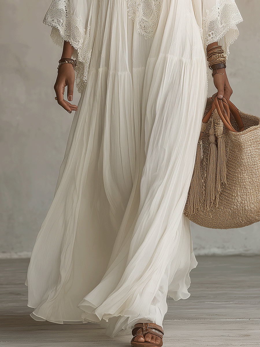 Vestido maxi de encaje blanco con escote en V y mangas murciélago de chifón