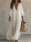 Vestido maxi de encaje blanco con escote en V y mangas murciélago de chifón