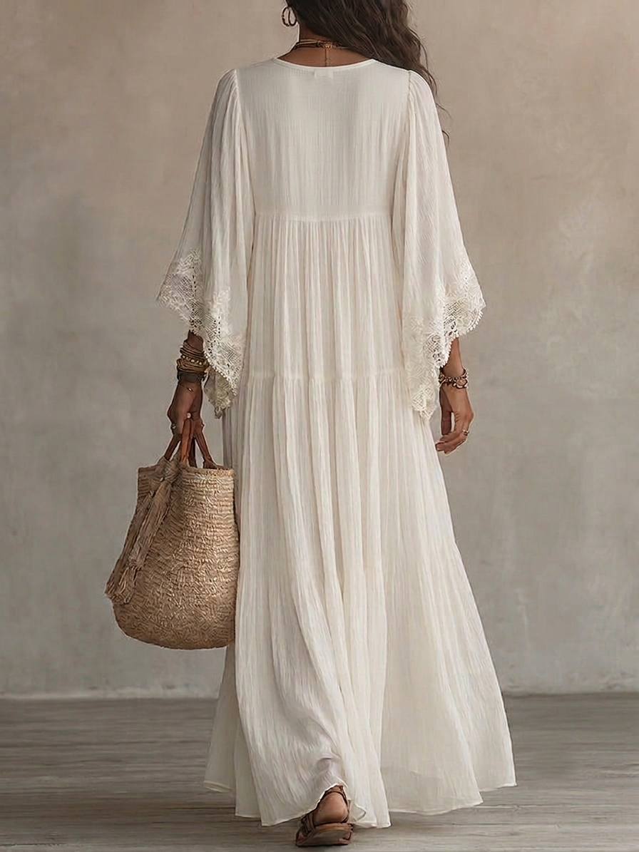 Vestido maxi de encaje blanco con escote en V y mangas murciélago de chifón