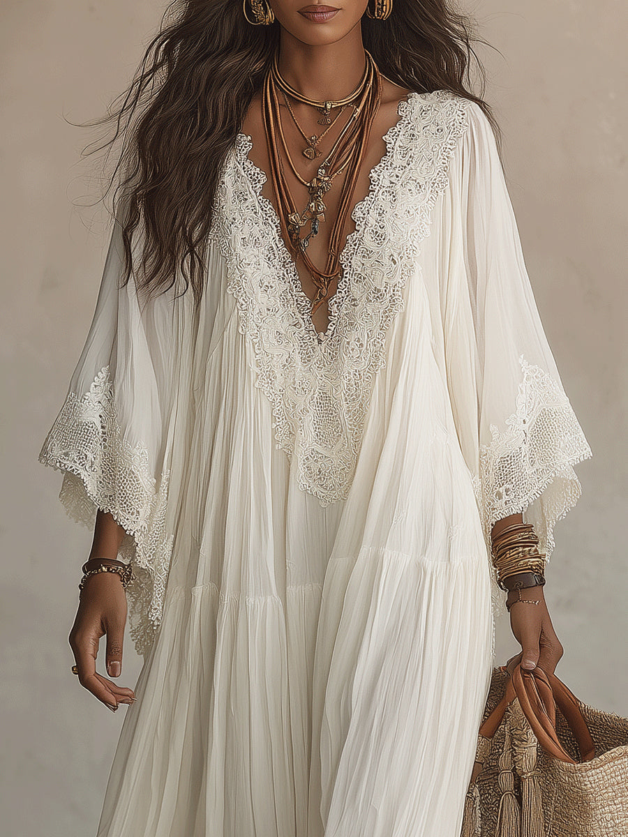 Vestido maxi de encaje blanco con escote en V y mangas murciélago de chifón